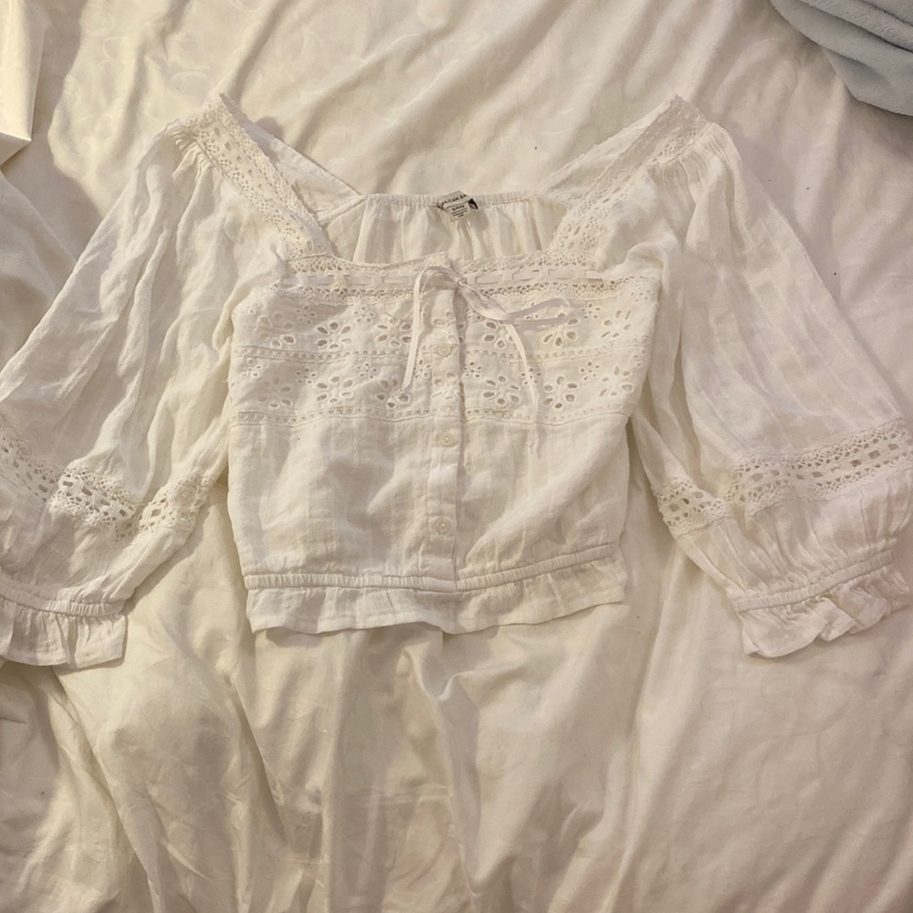Women’s American Eagle white, long sleeve off the shoulder crop top.